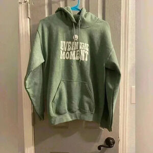 Unisex pullover sweatshirt hoodie with LIVE IN THE MOMENT in green with white